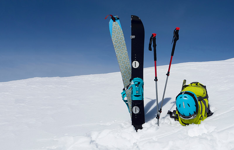 splitboard halves trekking sticks backpack sky | how to prepare for an avalanche