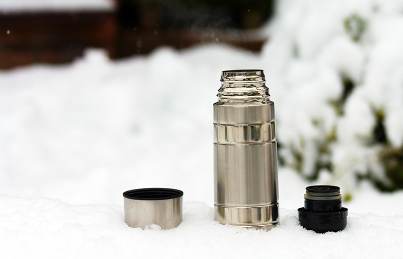 steaming thermos flask on hike | how to melt snow