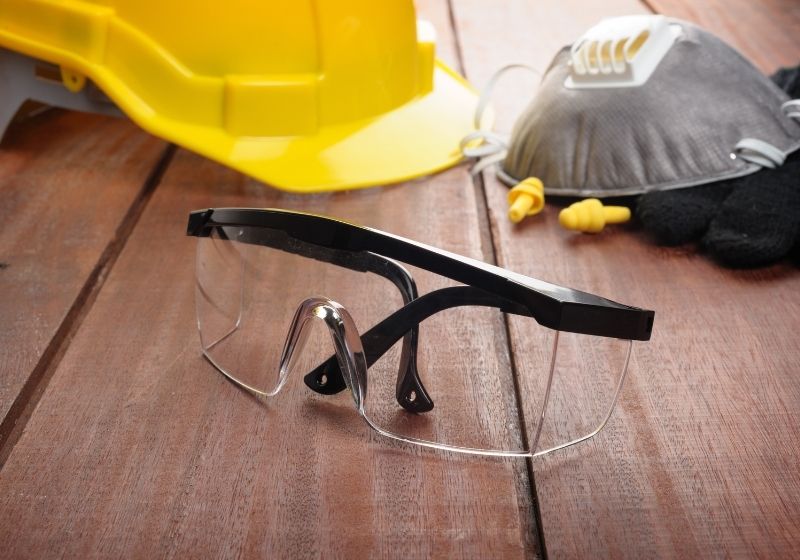 Safety glasses on wooden plank Blacksmithing guide SS