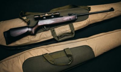brown and black sniper rifle with beige bag | How To Use A Picture Frame For Hidden Gun Storage | featured