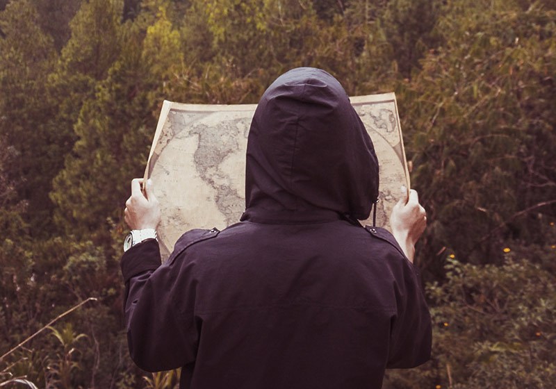 person reading a map | travel backpacking checklist 