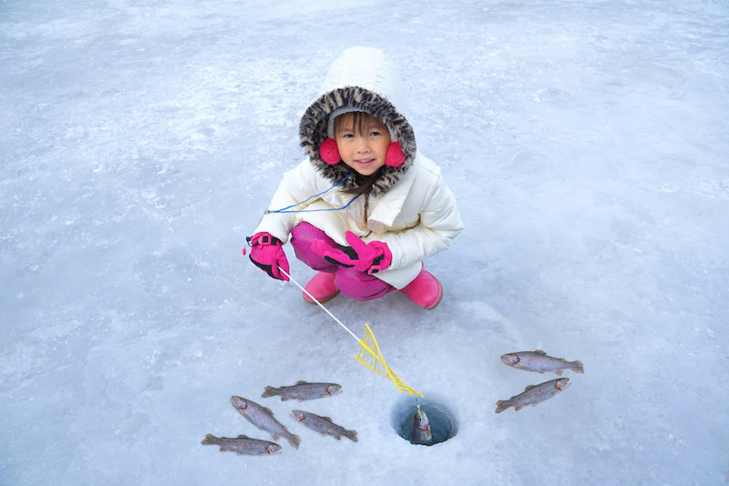 Cute girls are sitting on the floor of ice fishing | ice fishing science experiment