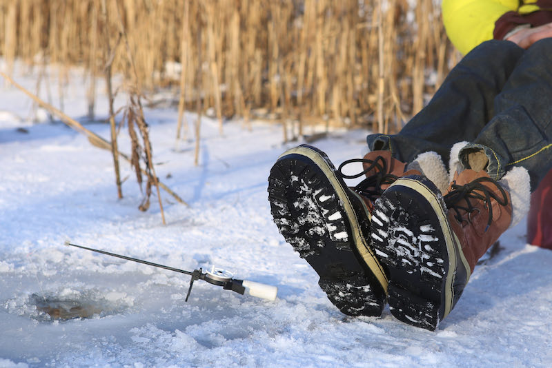 Ice fishing on frozen lake | ice fishing fish