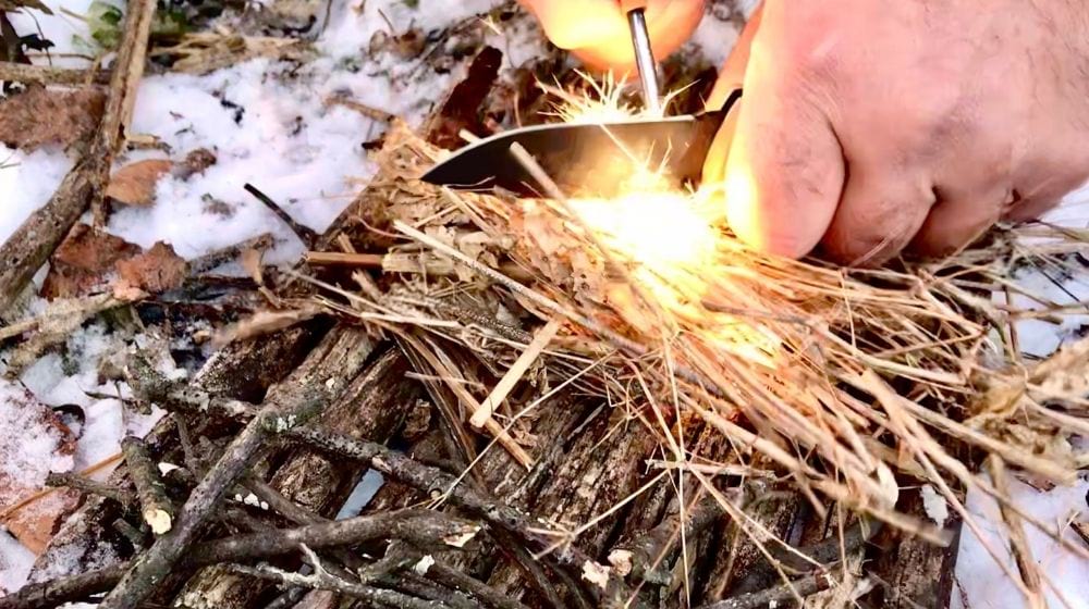 Starting fire with firestarter | What Is A Ferro Rod And How To Use It | Featured
