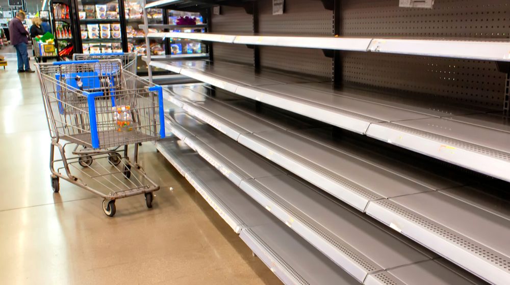 empty-shelves-supermarket-due-stockpiling-during stockpiling vs hoarding | Featured