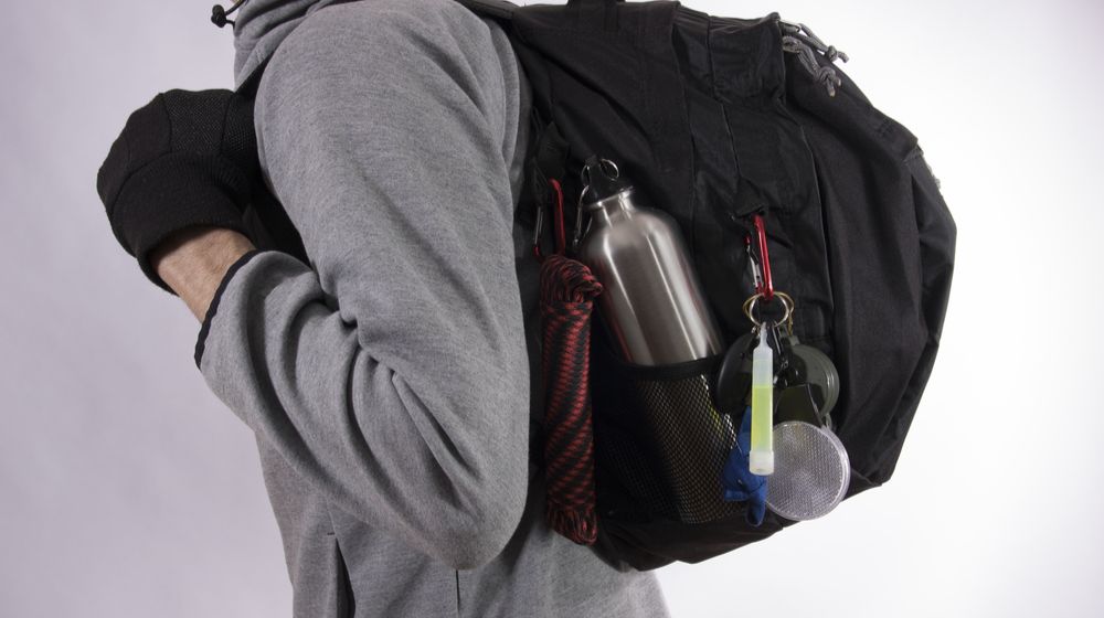man-bug-out-bag-on-gray survival tips from the TSP community | Featured