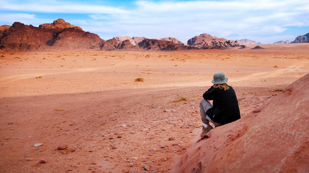 woman-tourist-looks-wonderful-landscape-view Surviving Being Trapped In The Desert | Featured