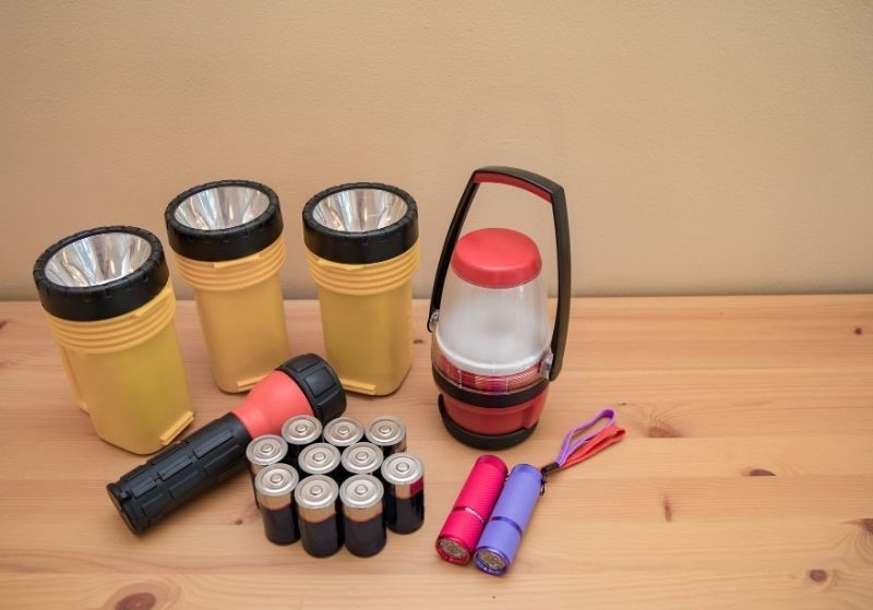 Flashlights and batteries laid out | blackout preparedness statistics
