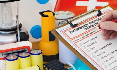Hand completing Emergency Preparation | Building a Power Outage/Blackout Kit | Featured