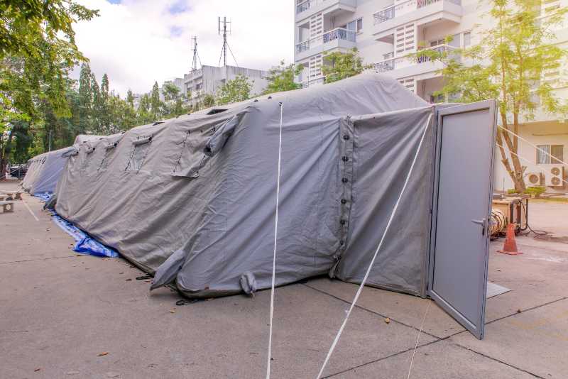 Military tent shelter on the street in town | What is an Emergency Shelter