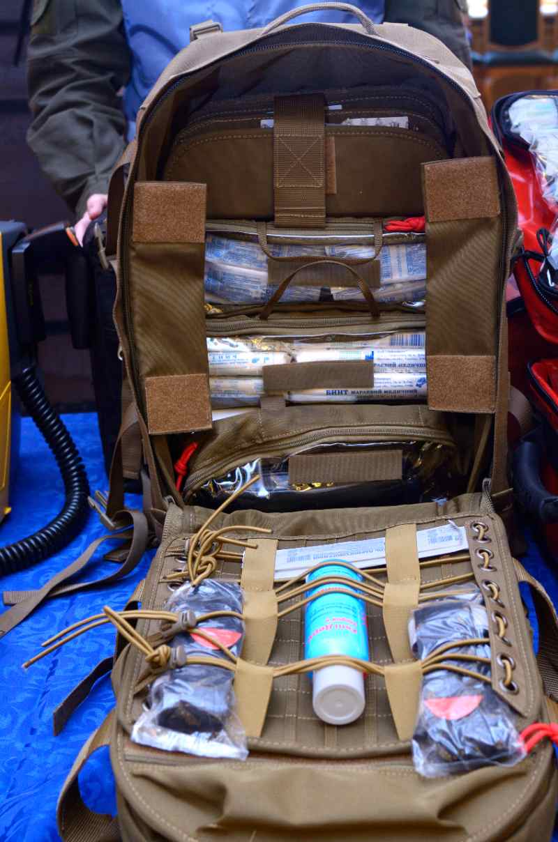 Backpack with soldier s first aid kit bandages, wound-healing drugs, balloon with burn-treating gel, painkillers-IFAK