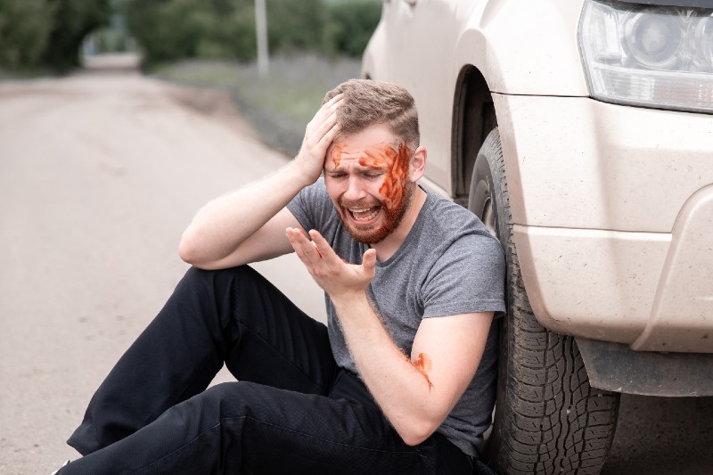 Car accident, man sits with bloodied head near wheel, screaming and crying | Hemorrhagic Shock