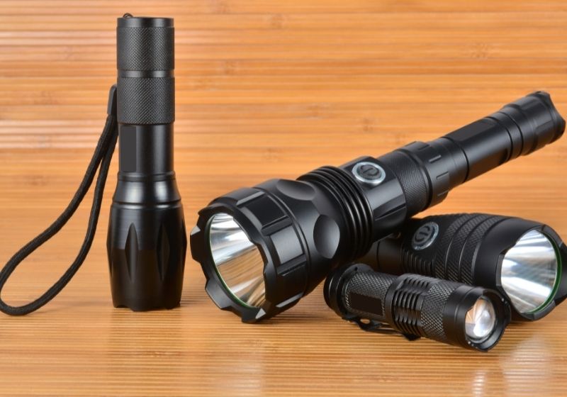 Four tactical lights on a wood background Pet emergency SS