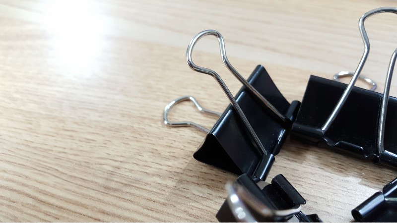 Set of office clips for paper on a white background-binder clips