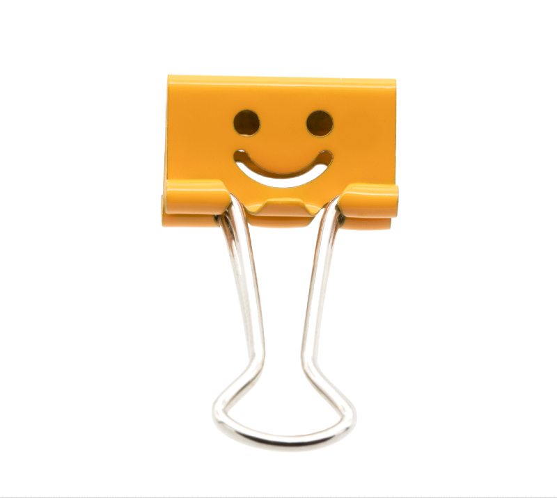 Smile orange binder clip isolated on white background-binder clips