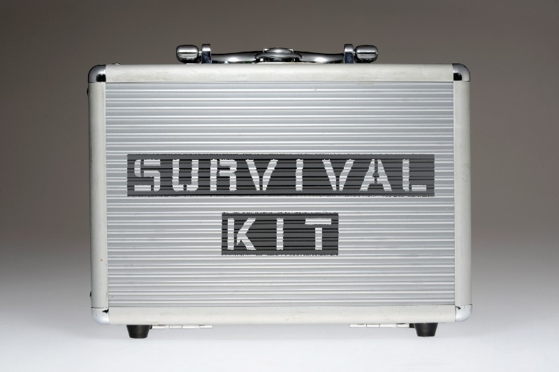 metallic box with survival kit phrase stencil print on it side-BUDGET SURVIVAL KIT