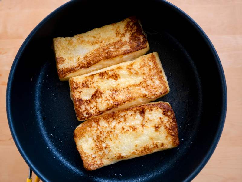 Baking french toast for breakfast at camp-camping food on a budget