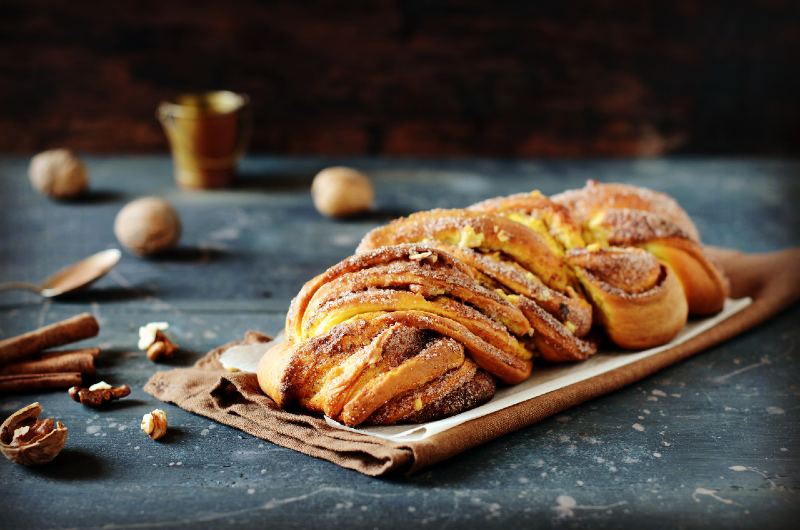 Cinnamon twisted loaf bread or babka on a dark wooden background-healthy camping meals