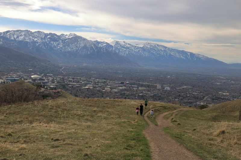 Family on a stroll in the foothills of the Wasatch enjoying views of downtown Salt Lake City-best hiking trails
