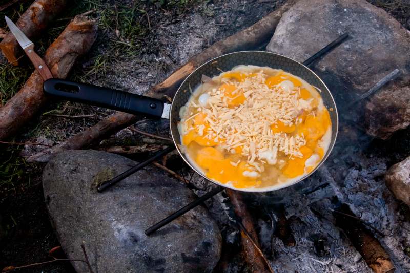 Scrambled eggs cooked on picnic fire-classic camping food