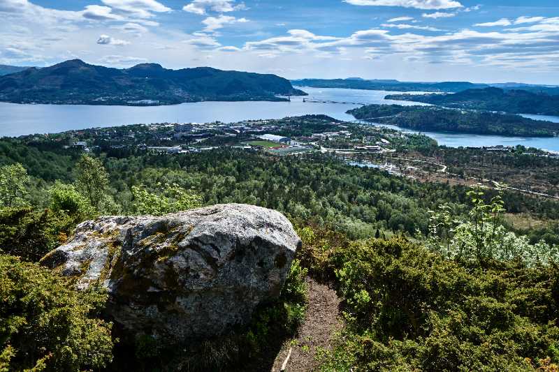 Spectacular view from a boulder. Hiking Mount Indregardsfjellet-terrain