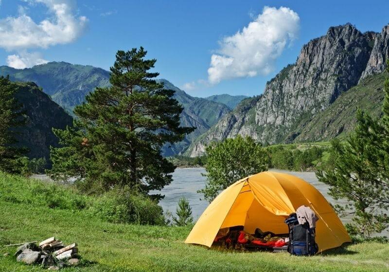 The Camping Tent near mountain river in the summer Camping checklist SS