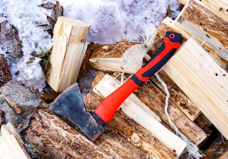 red tourist hatchet on chopped wood Car camping essentials SS