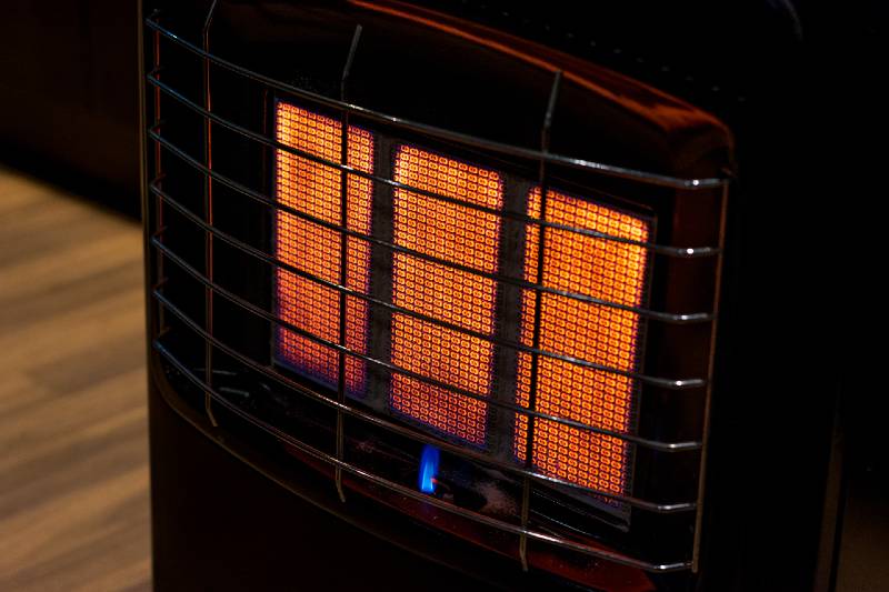 An insulated gas heater burning at full capacity on a freezing winter night - item for sale