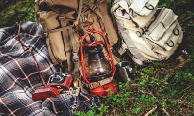 Travel set, blanket are vintage compass, camera, canteen and a flashlight | 5 Simple Packing Tips That Will Make Your Camp Life Easier | featured