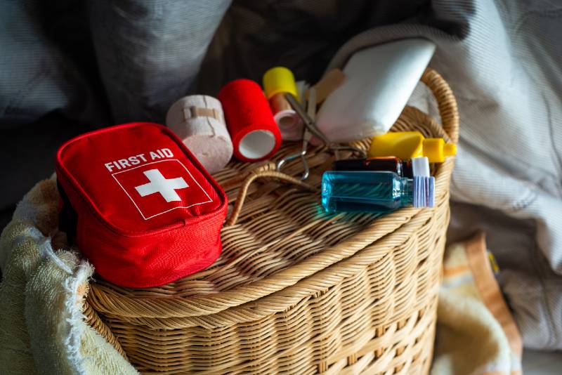 first aid kit bag on wood background, Medical concept, First aid equipment, First Aid Supplies-Medical Supplies