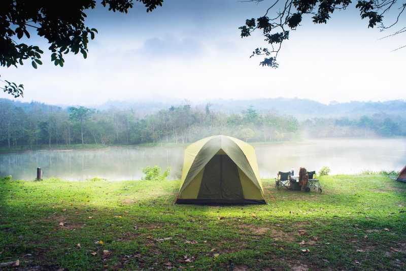 Camping tent with lake background-How to Find A Good Campsite