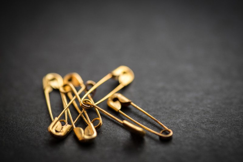 Safety pin on a dark background-Prepping Supplies