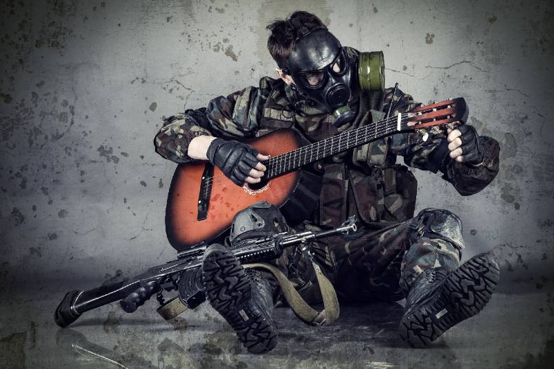 Man with Gas Mask Plays Guitar Survival Skill Set