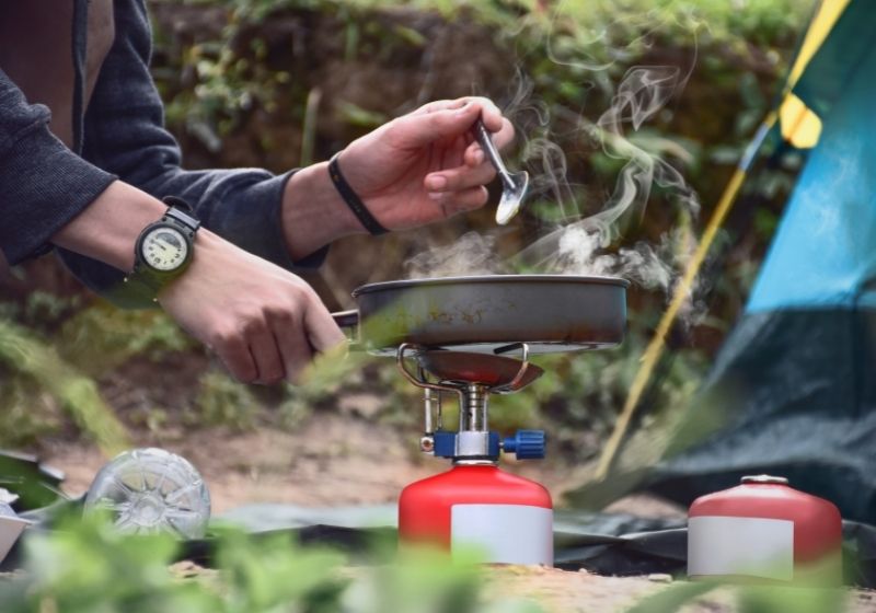 Breakfast in front of the tent in the morning | Top Best Portable Camping Stoves 