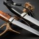 Hunting-knife-handmade-on-a-black-background | What You Must Look for in a Survival Knife | featured