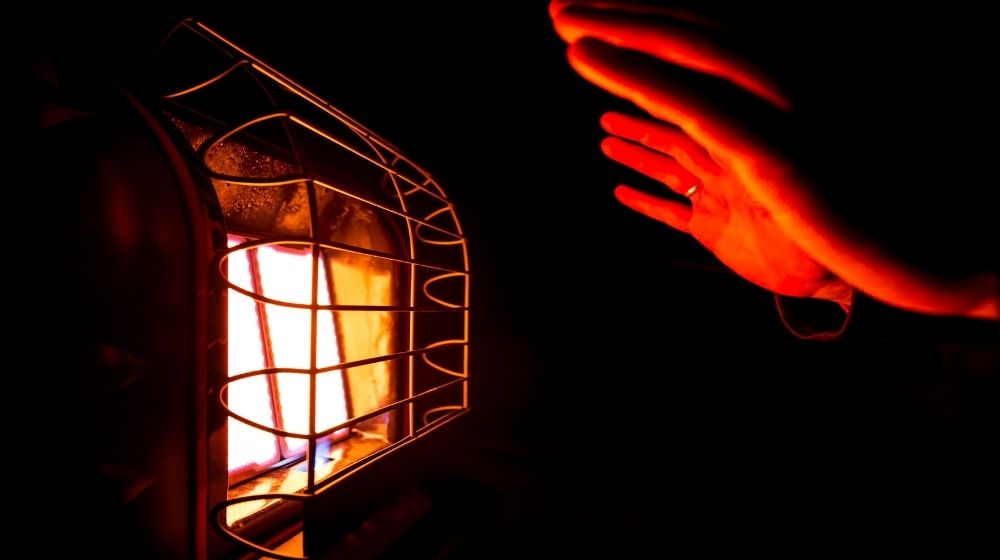The warm glow reflecting off a heating element | Tent Heater | 10 Best Tent Heaters for Camping | Featured