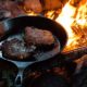 A Frying Pan with Two Slices of Steak on Campfire | Camping Food Hacks | Featured