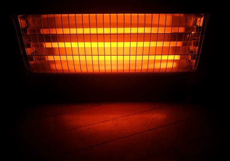 An open heater in a dark background | National Grid Outage | How to Prepare for Power Grid Failure