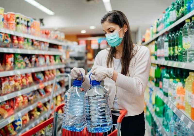 Buyer wearing a protective mask shopping during the pandemic | How to Survive a Power Grid Attack