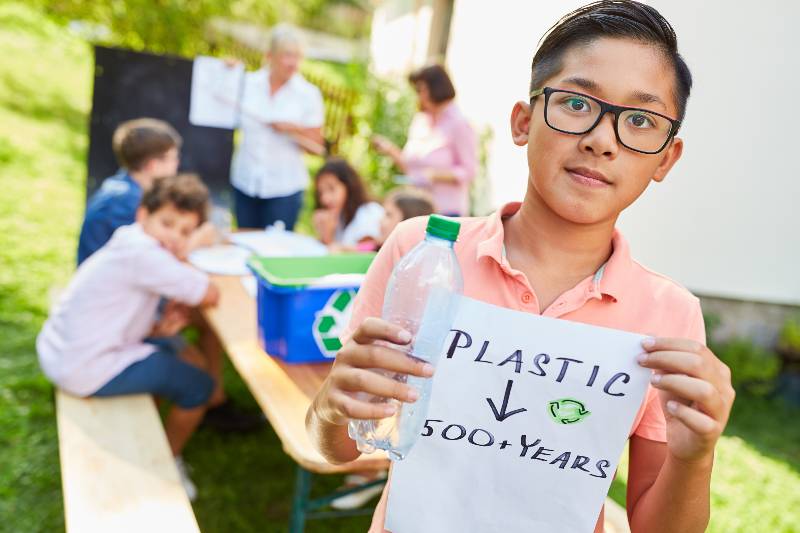 Child as an activist and environmentalist in a recycling project for plastic waste | Environmental Policy