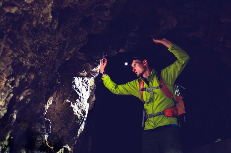 Man exploring dark cave | Headlamps