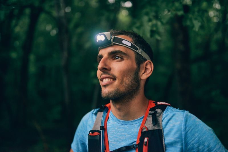 fit-male-jogger-headlamp-rests-during | headlamps
