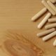 Many wooden dowels on a plank | Joining Wood with Dowels | 10 Easy Steps to Join Wood with Dowels | featured