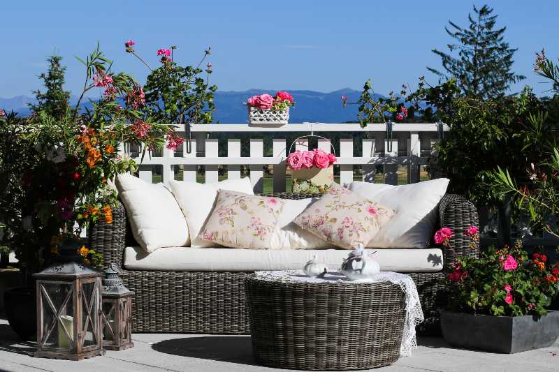 Tea-set and beautiful flowers on sunny terrace-Balcony Gardens Ideas