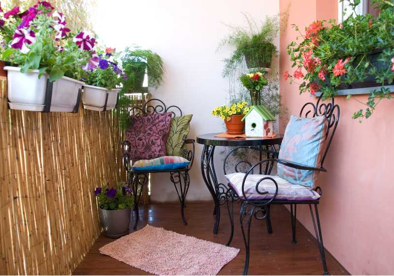 beautiful black furniture on flowery terrace-Balcony Gardens Ideas