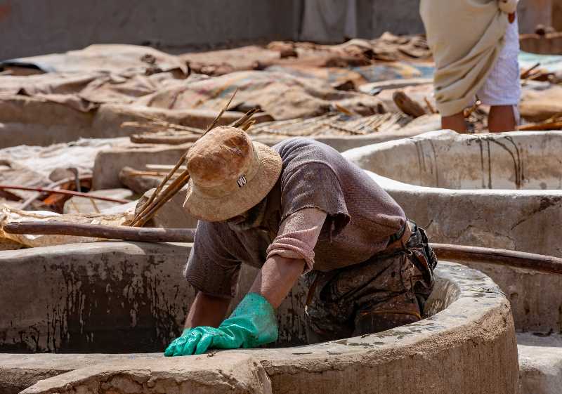 people perform the work in tannery souk-How to Make Rawhide