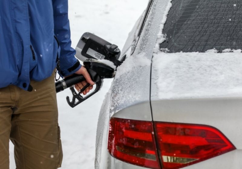 Man filling fuel to his diesel car at gas station | Winterize Car | 13 Ways on How to Winterize a Car