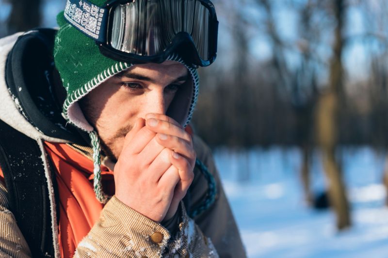 man-warming-his-hands-winter hypothermia
