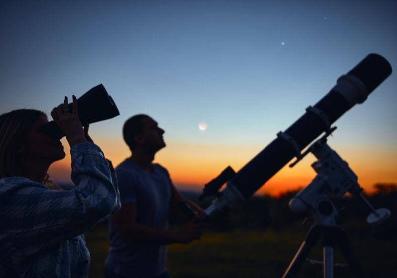 Couple stargazing together with a astronomical telescope | Camping Near Valentine NE | Valentine Nebraska