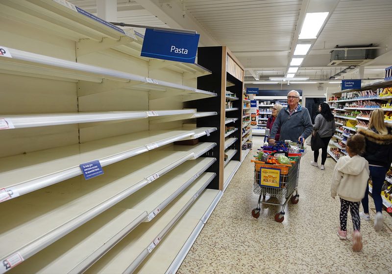 Empty shelves in a supermarket. Retail outlets around the world have reportedly sold out of basic household necessities due to covid-19 stockpiling | Will Society Collapse | Society Collapse 2040 | How to Survive the Collapse of Civilization | Stockpile